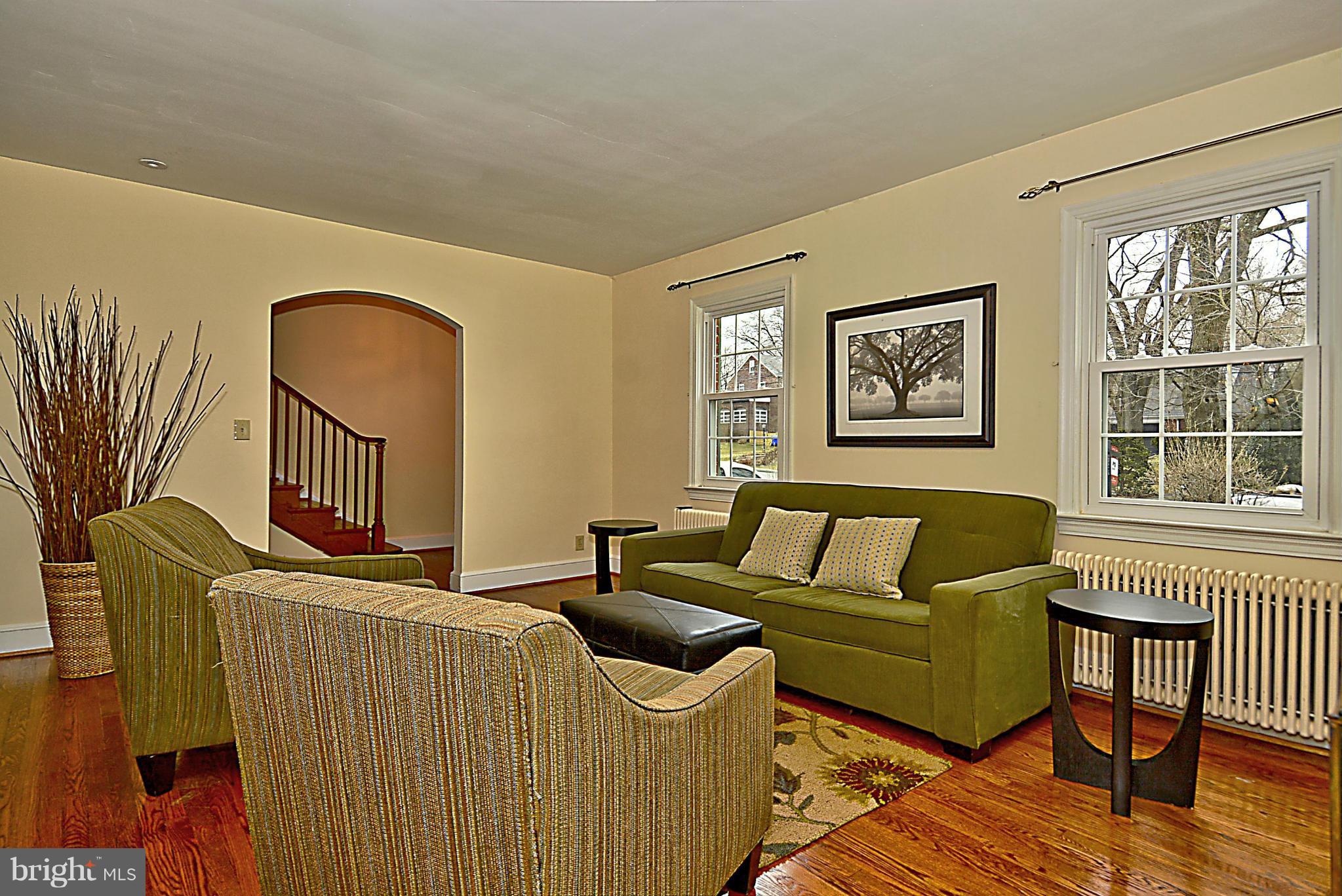 1111 Woodside Parkway Silver Spring, MD 20910 - Photo 5 of 30 a living room with furniture and a window