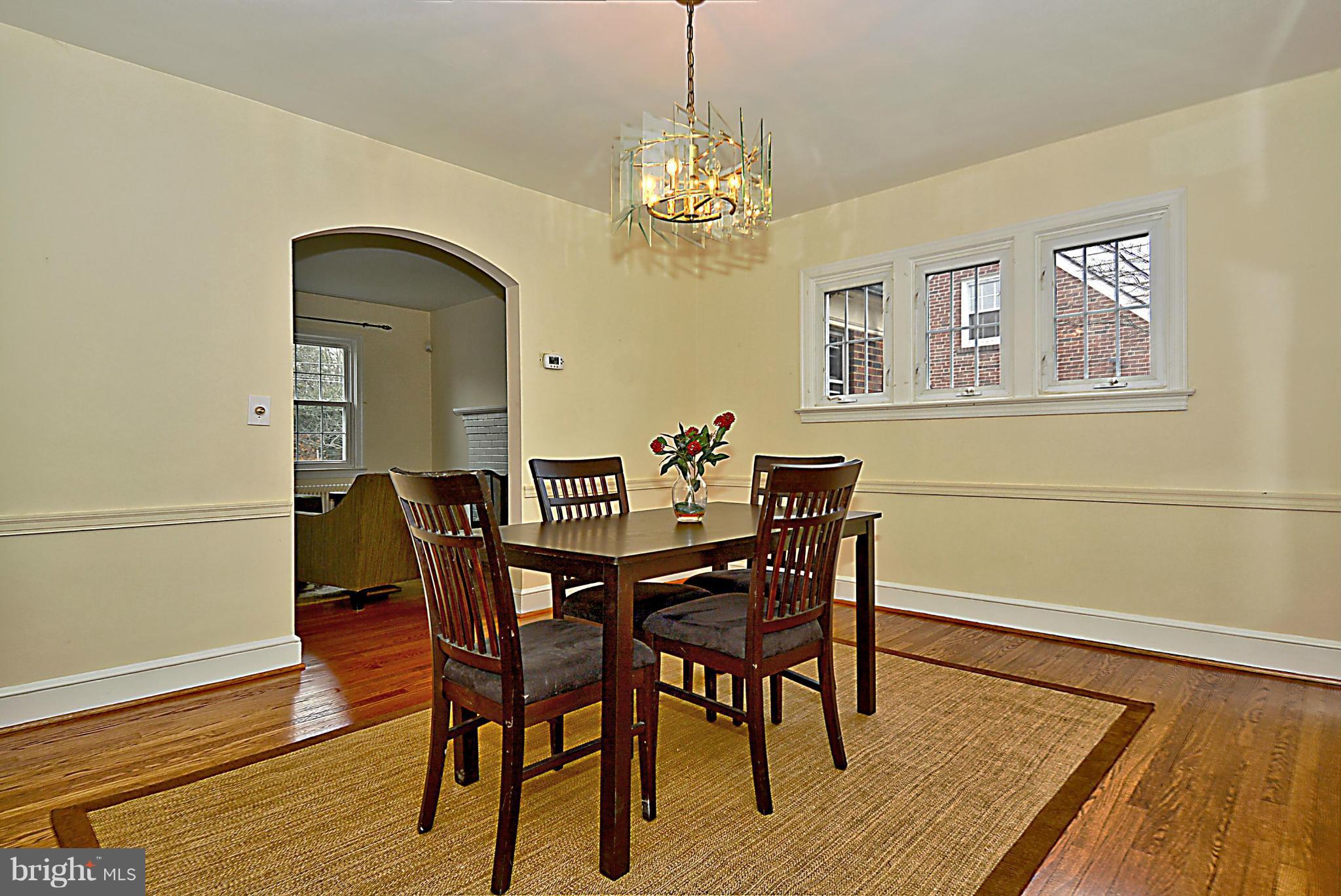 1111 Woodside Parkway Silver Spring, MD 20910 - Photo 7 of 30 a view of a dining room with furniture and wooden floor