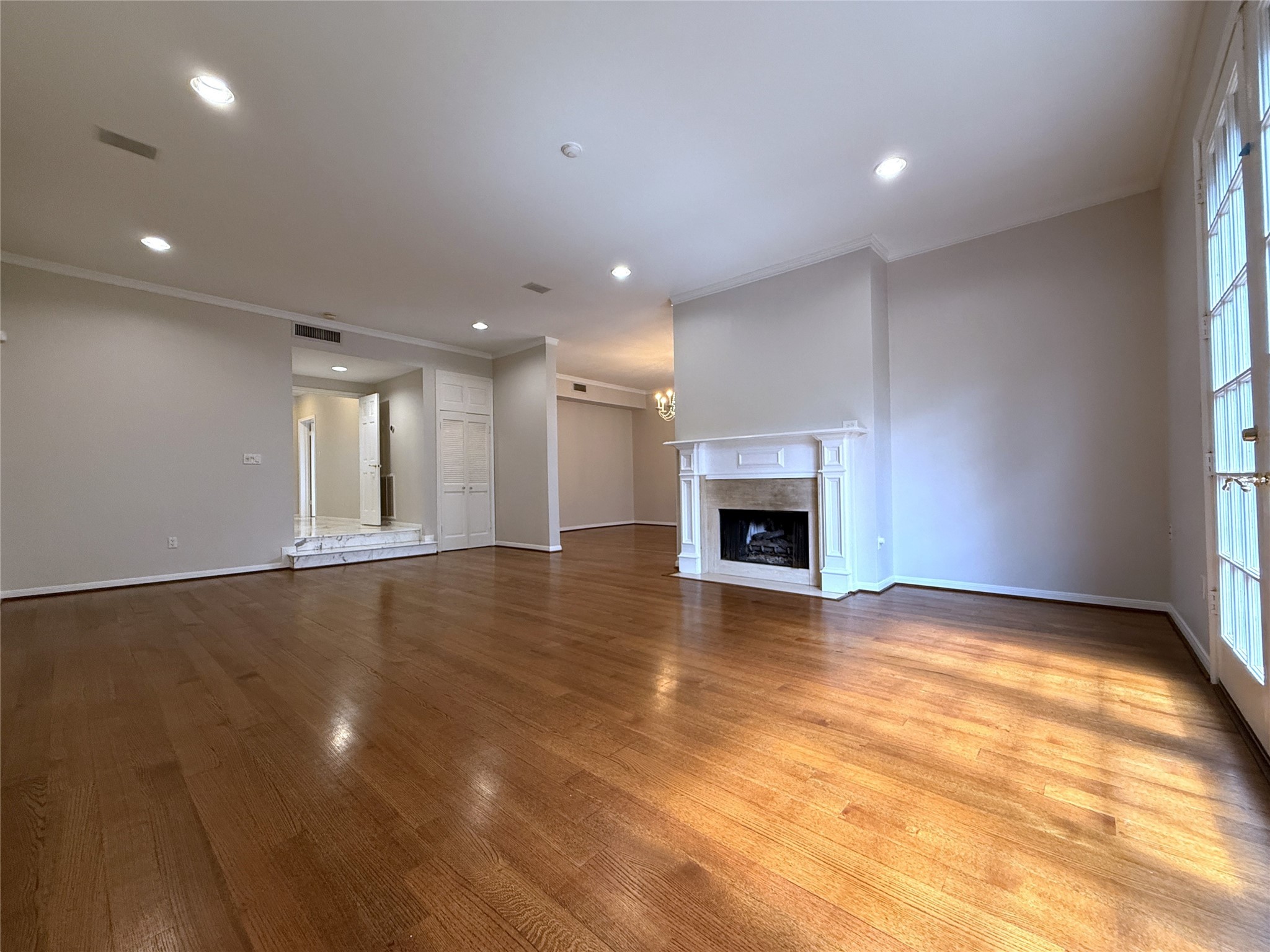 2813 Saint Street Houston, TX 77027 - Photo 16 of 39 Alternate view of the living room offering a mock fireplace and recessed lighting.