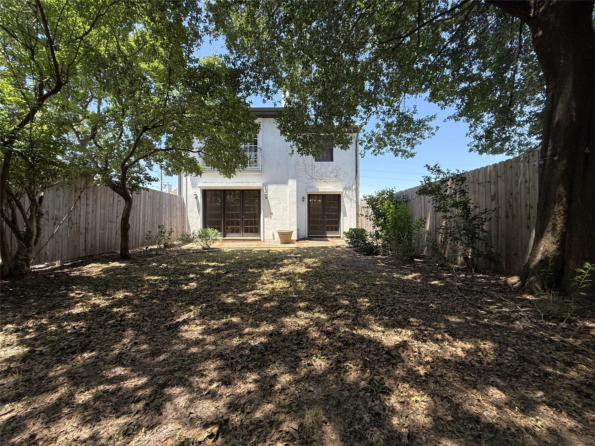 2813 Saint Street Houston, TX 77027 - Photo 18 of 39 The yard offers trees and privacy.