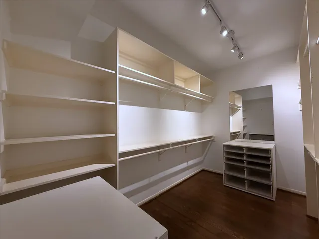 a bathroom with a sink a large mirror and shower