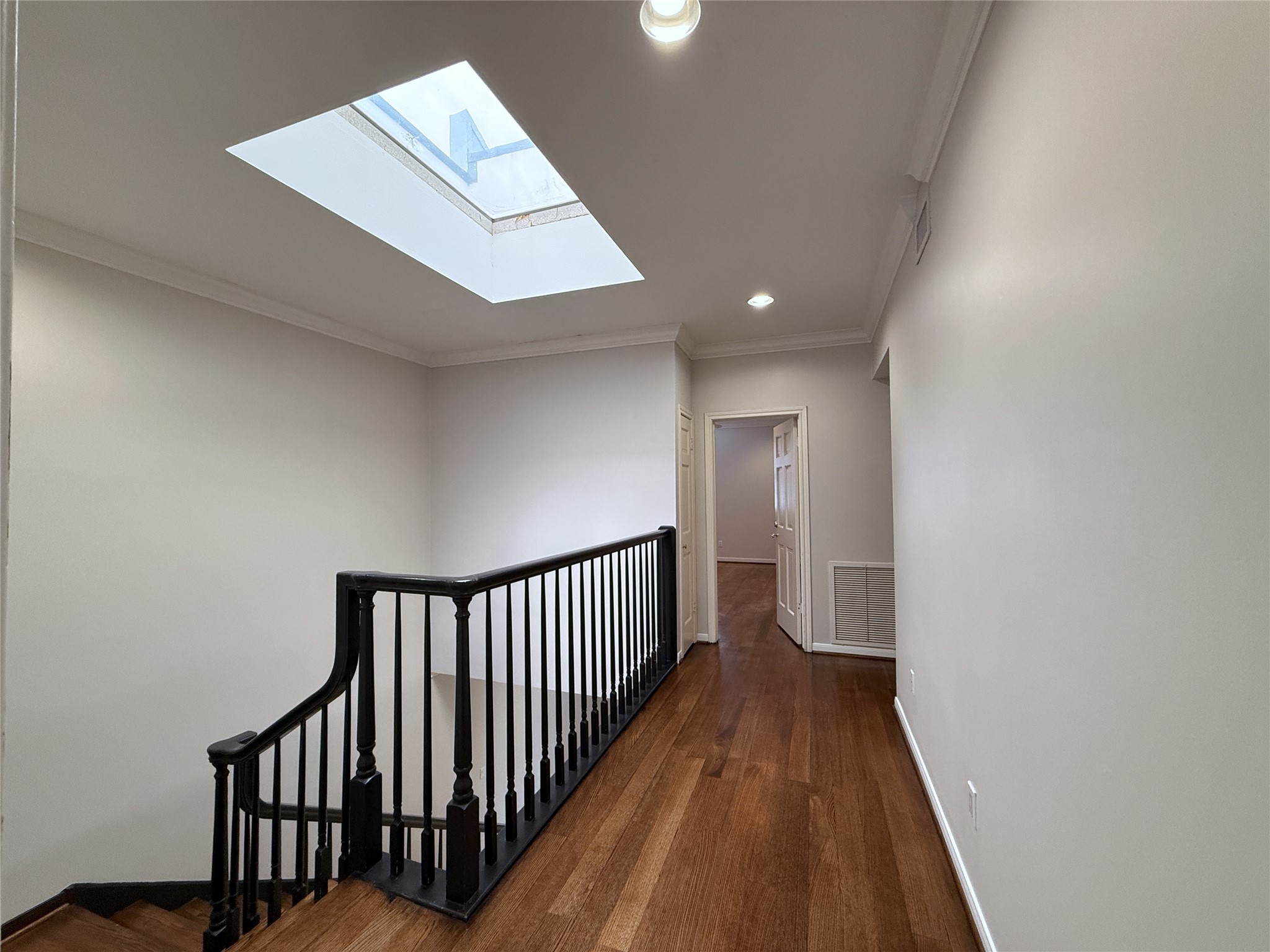 2813 Saint Street Houston, TX 77027 - Photo 30 of 39 From the primary suite, the two secondary bedrooms are located at the opposite end of the home.