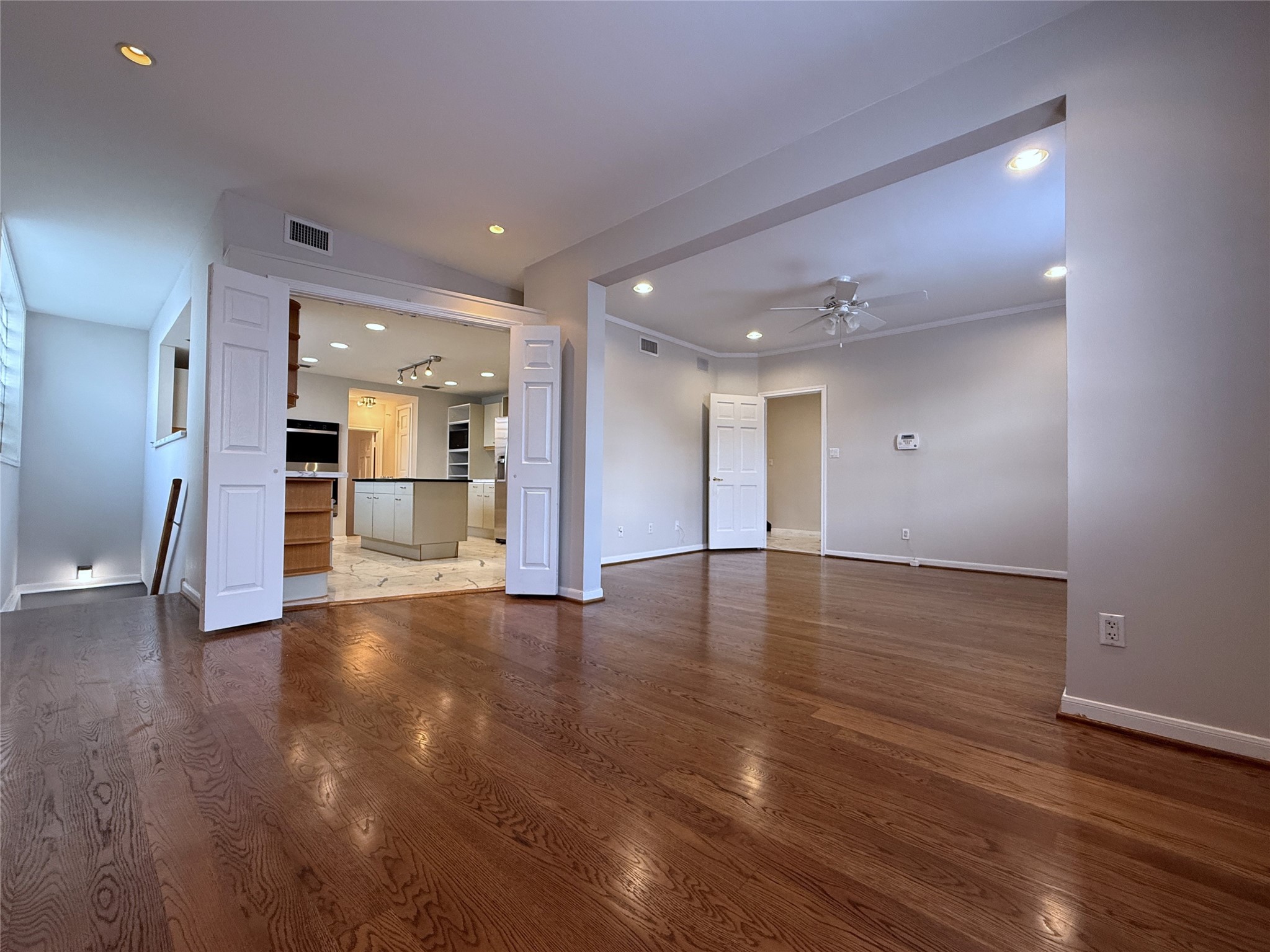 2813 Saint Street Houston, TX 77027 - Photo 7 of 39 Viewing from the breakfast room, notice the kitchen can be closed off by folding doors for privacy.