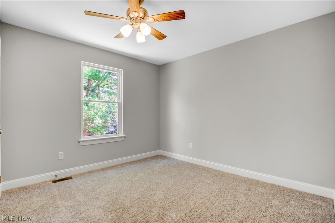 12412 Snow Road Burton, OH 44021 - Photo 28 of 45 Unfurnished room featuring ceiling fan and carpet