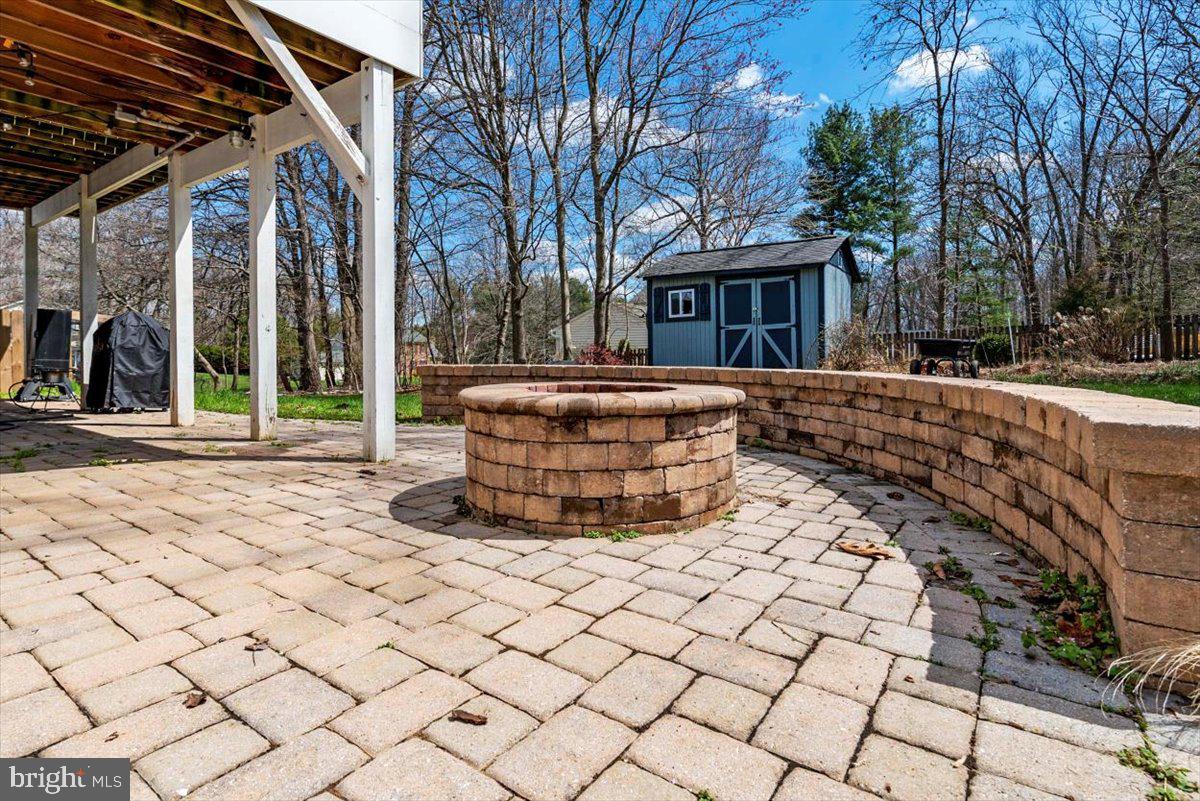 2167 Tulsa Road Sykesville, MD 21784 - Photo 34 of 37 Fire pit and beautiful paver patio!
