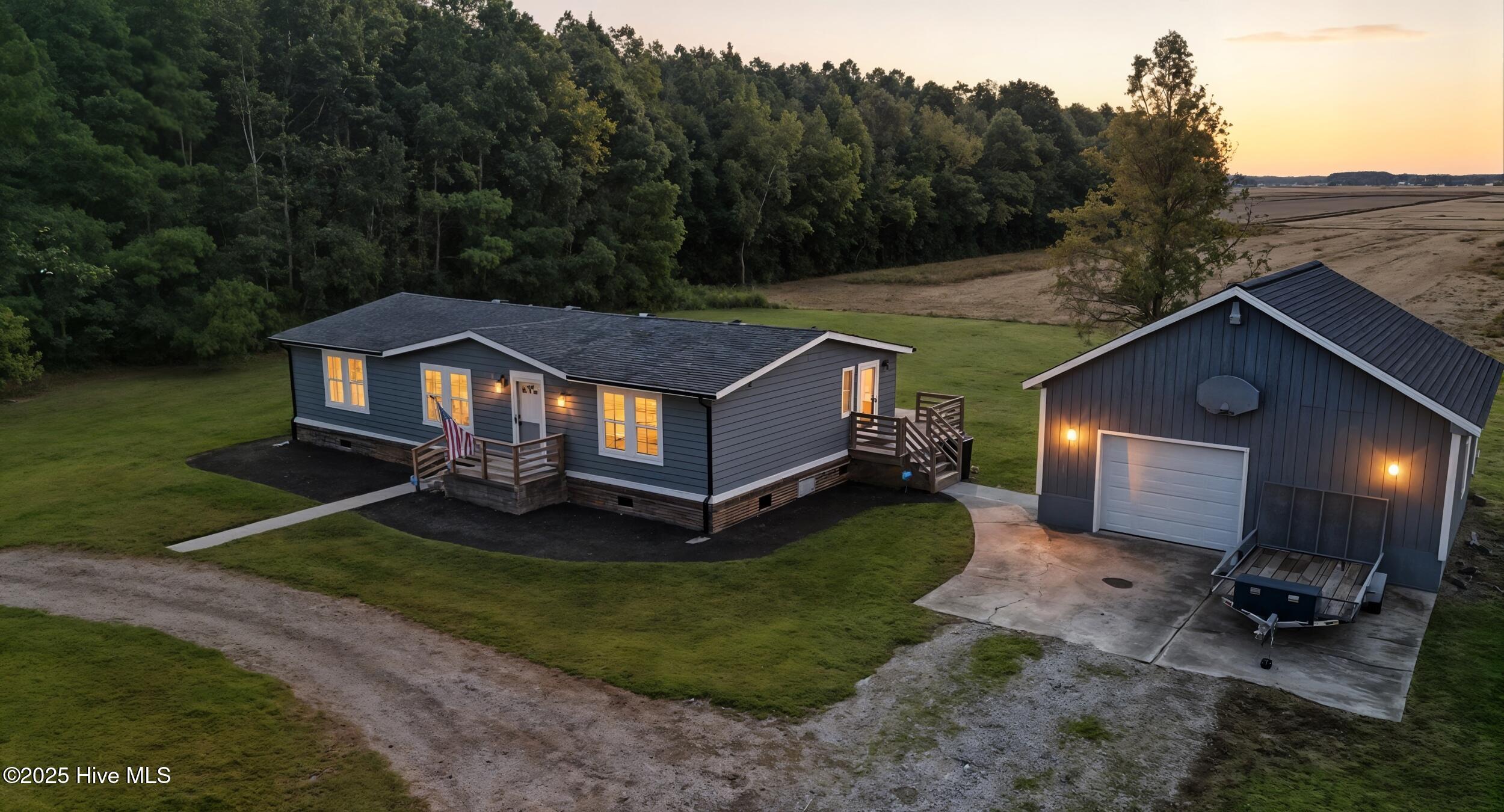 159 Keeter Barn Road South Mills, NC 27976 - Photo 3 of 30 1_dji_20251010215708_0062_d_twilight_52f