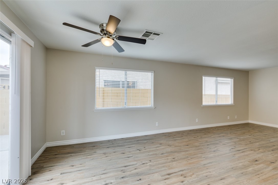 905 Scarlet Ridge Drive Las Vegas, NV 89128 - Photo 15 of 39 Empty room with light wood-style flooring and ceiling fan