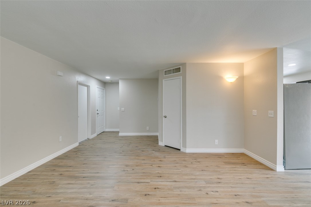 905 Scarlet Ridge Drive Las Vegas, NV 89128 - Photo 9 of 39 Spare room featuring light wood finished floors and recessed lighting