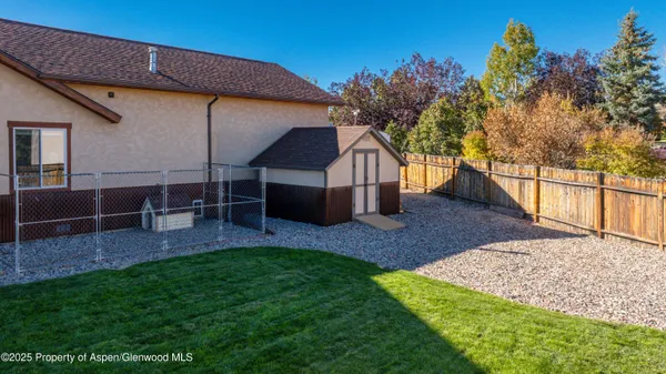 a view of house with backyard and entertaining space
