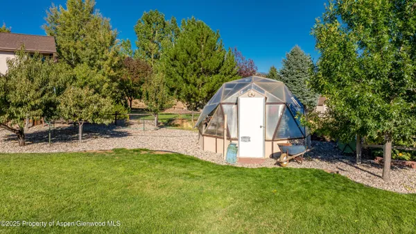 a view of backyard with a garden and entertaining space