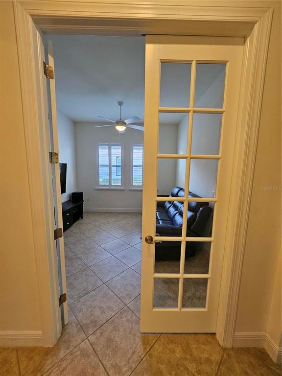 1283 Manado Drive Naples, FL 34113 - Photo 13 of 48 a view of a livingroom with furniture and front door