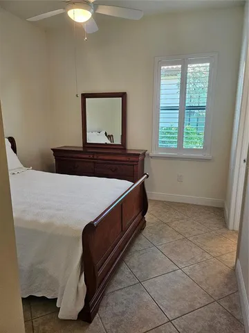 a room with a bed and a mirror