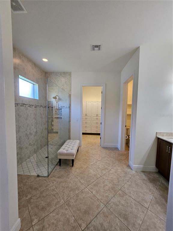1283 Manado Drive Naples, FL 34113 - Photo 28 of 48 a view of a livingroom with a walk in closet and bathroom