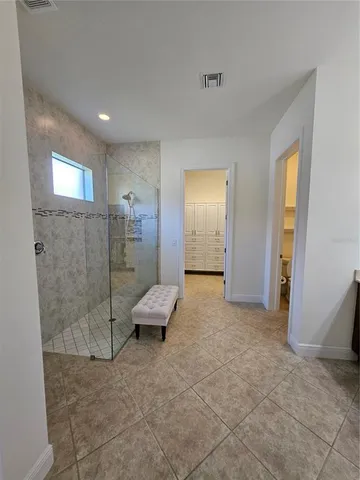 a view of an empty room and bathroom