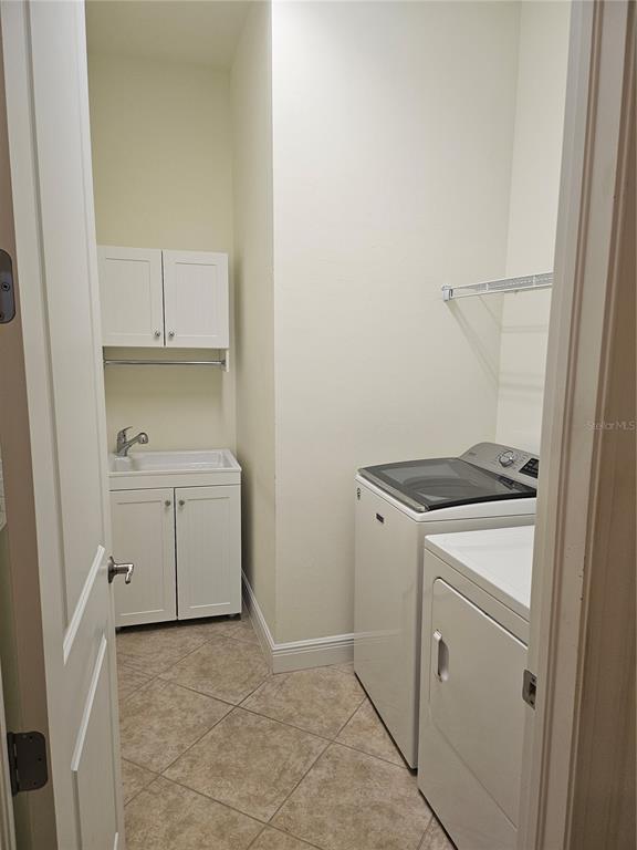 1283 Manado Drive Naples, FL 34113 - Photo 33 of 48 a utility room with dryer and washer