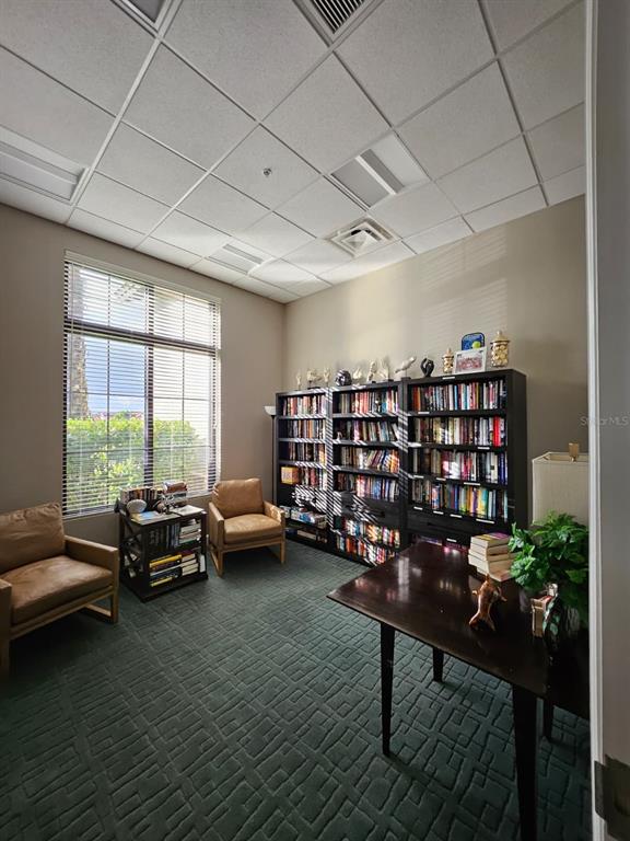 1283 Manado Drive Naples, FL 34113 - Photo 39 of 48 a livingroom with furniture and a book shelf