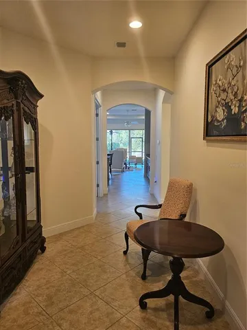 a view of a livingroom with furniture and a potted plant
