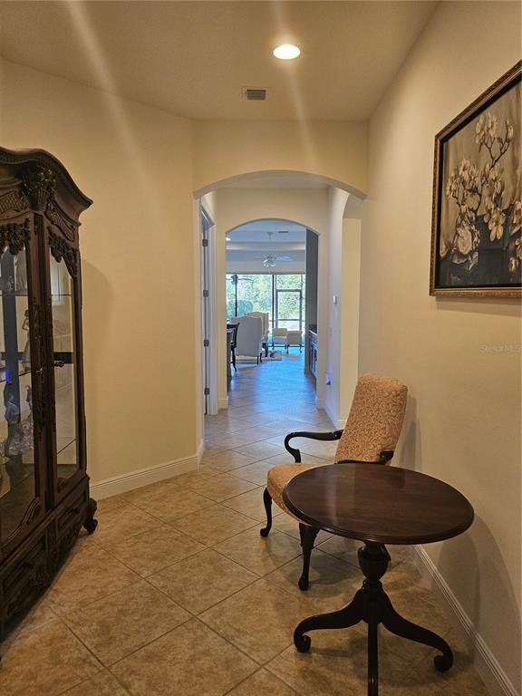 1283 Manado Drive Naples, FL 34113 - Photo 4 of 48 a view of a livingroom with furniture and a potted plant