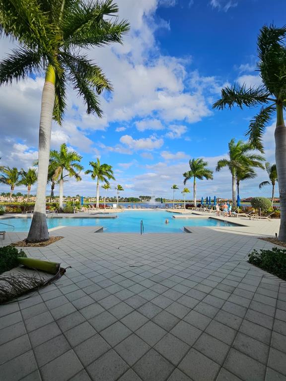 1283 Manado Drive Naples, FL 34113 - Photo 41 of 48 a view of an outdoor space and swimming pool