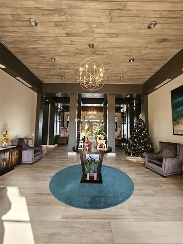 a livingroom with furniture and a large window