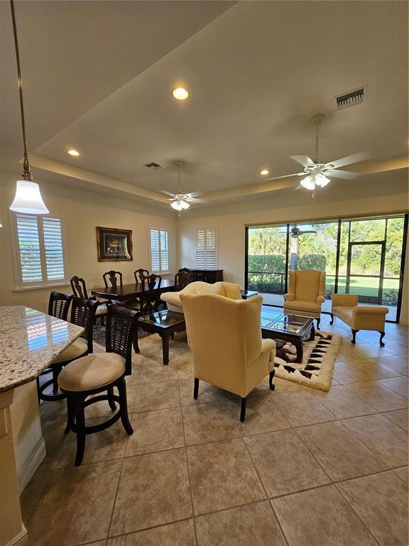 1283 Manado Drive Naples, FL 34113 - Photo 7 of 48 a living room with lots of chairs and a table
