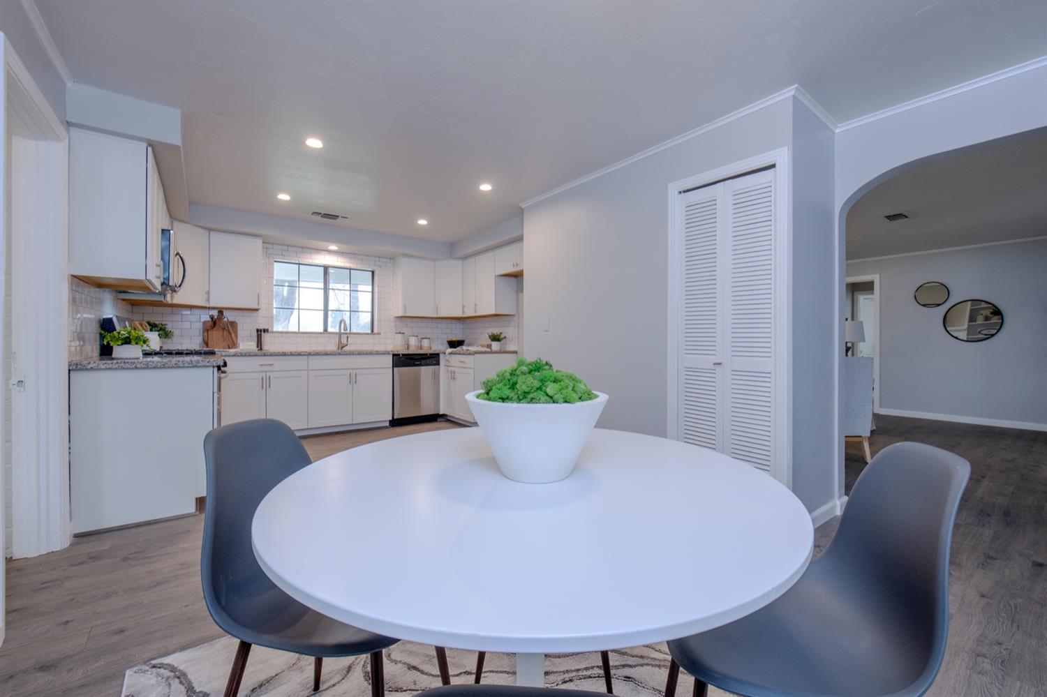 1322 North Reed Avenue Reedley, CA 93654 - Photo 13 of 54 a view of a dining room with furniture and wooden floor