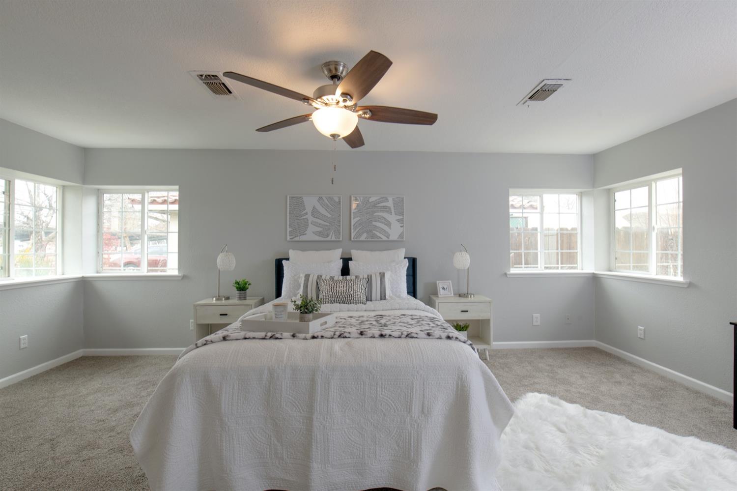 1322 North Reed Avenue Reedley, CA 93654 - Photo 20 of 54 a bedroom with a bed and window