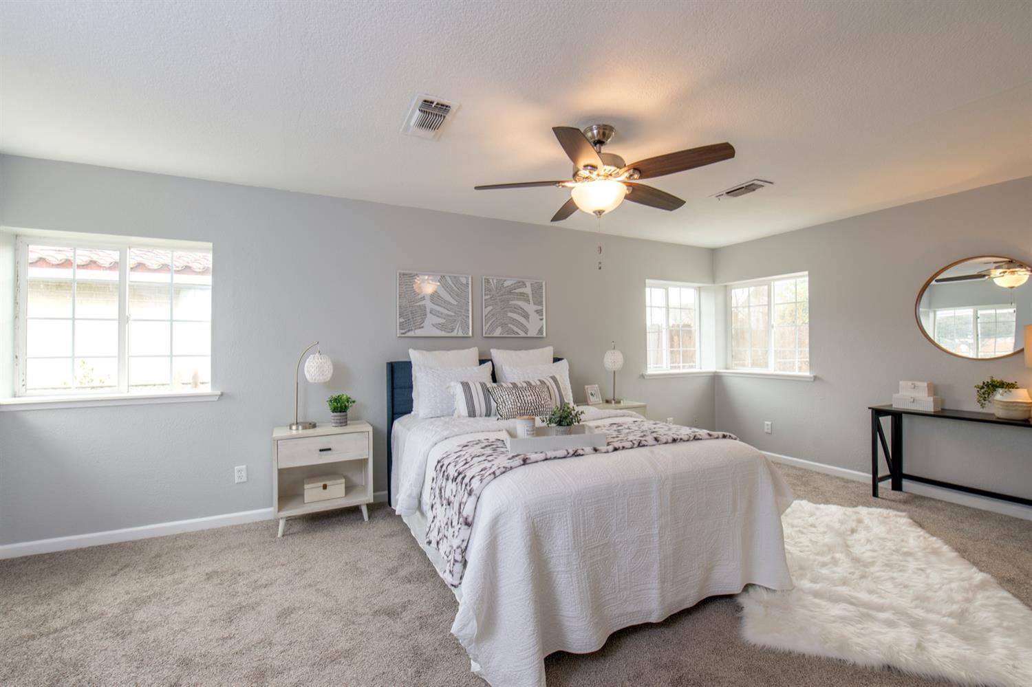 1322 North Reed Avenue Reedley, CA 93654 - Photo 21 of 54 a bedroom with bed and a window