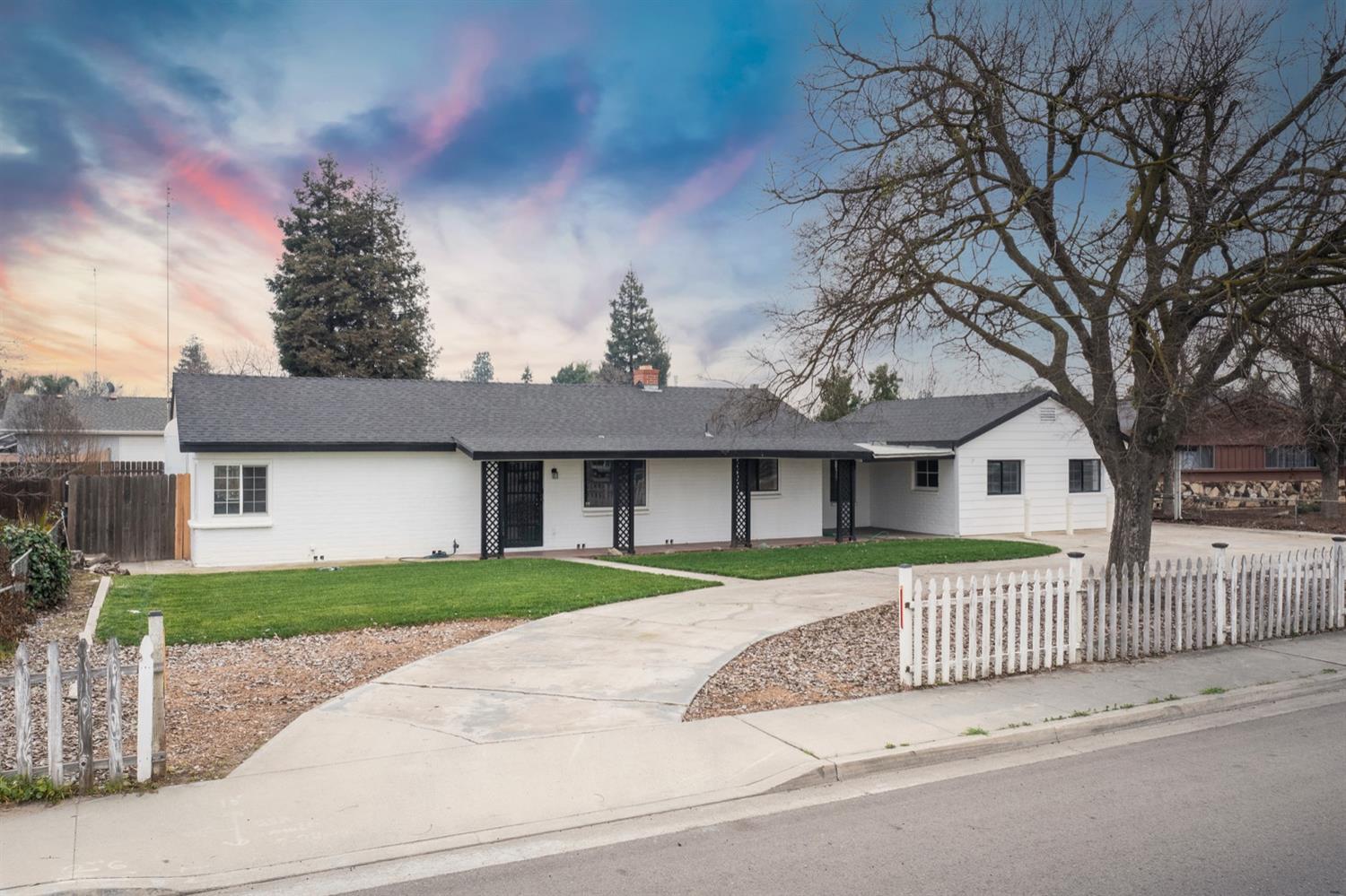 1322 North Reed Avenue Reedley, CA 93654 - Photo 3 of 54 front view of a house with a yard
