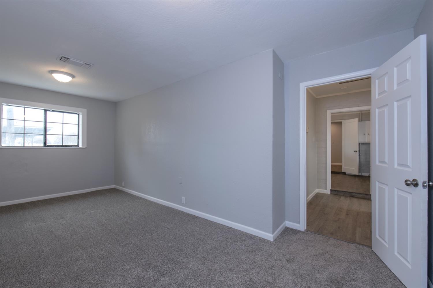 1322 North Reed Avenue Reedley, CA 93654 - Photo 32 of 54 an empty room that has a window