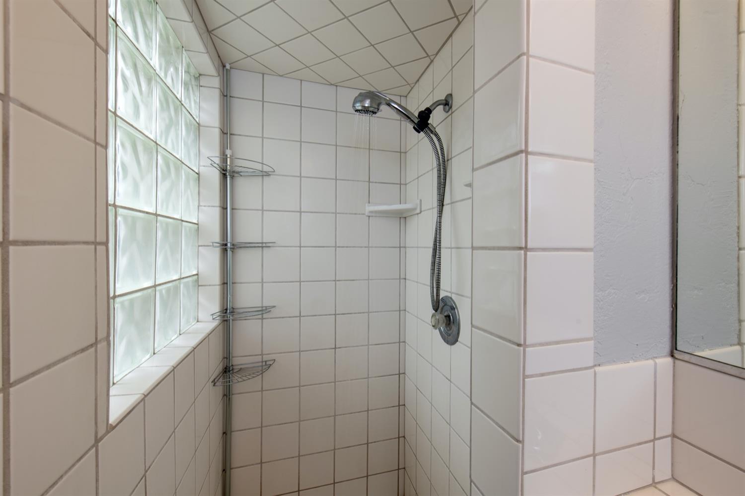1322 North Reed Avenue Reedley, CA 93654 - Photo 35 of 54 a bathroom with a shower