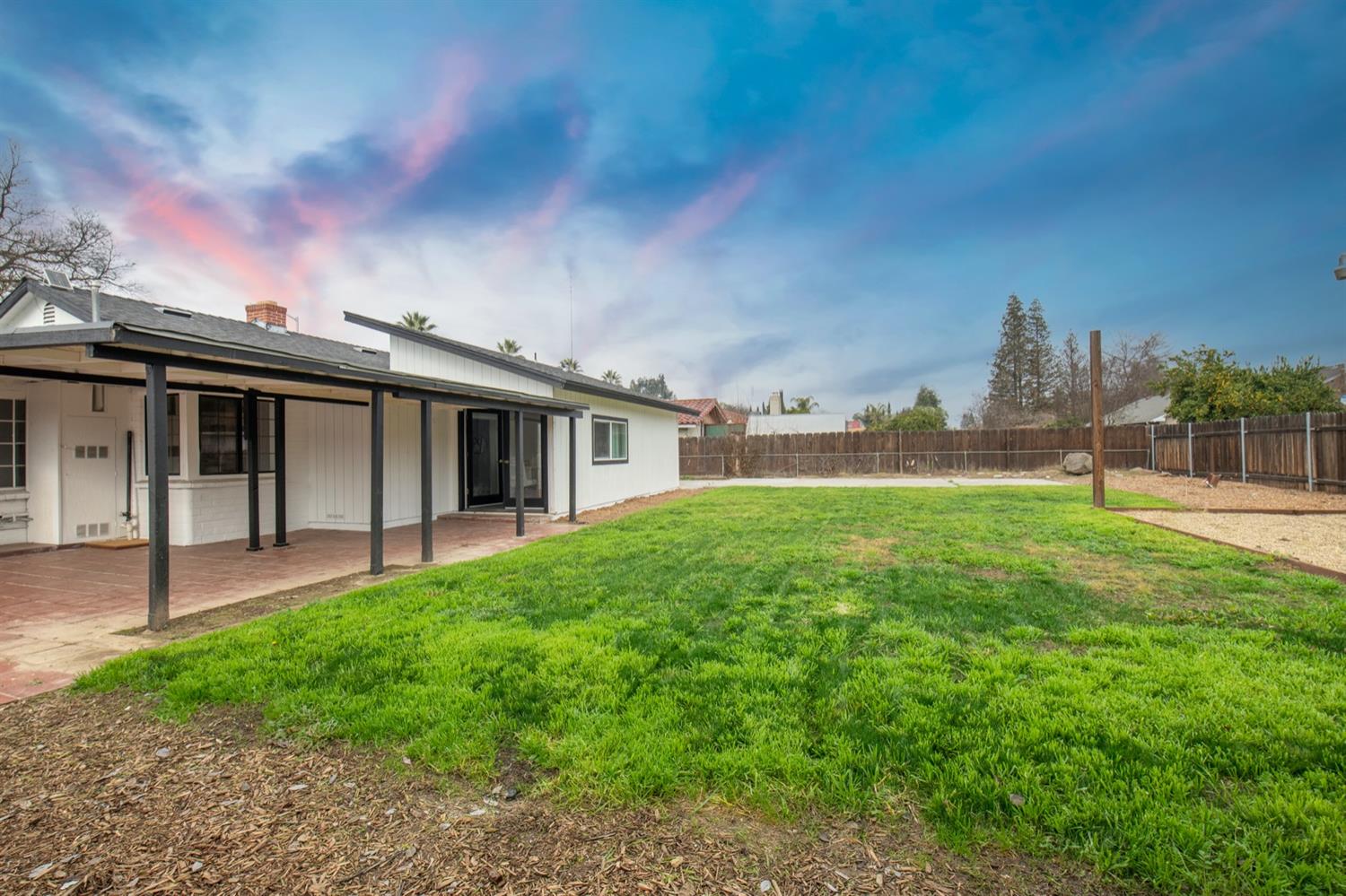 1322 North Reed Avenue Reedley, CA 93654 - Photo 37 of 54 front view of a house with a yard