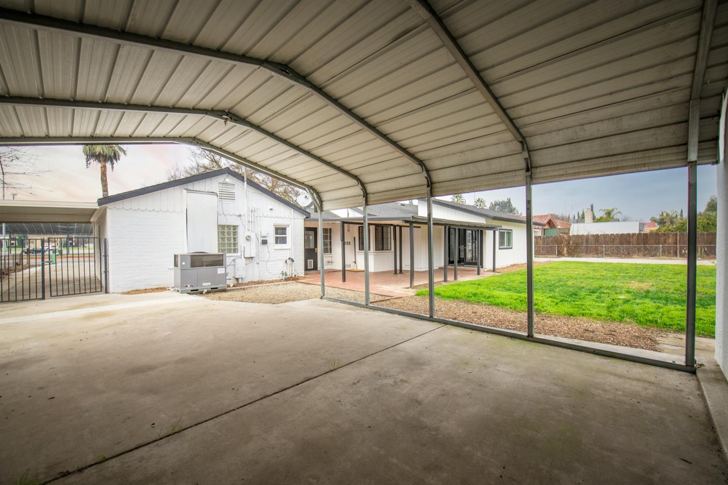 1322 North Reed Avenue Reedley, CA 93654 - Photo 38 of 54 a view of a house with porch and garden