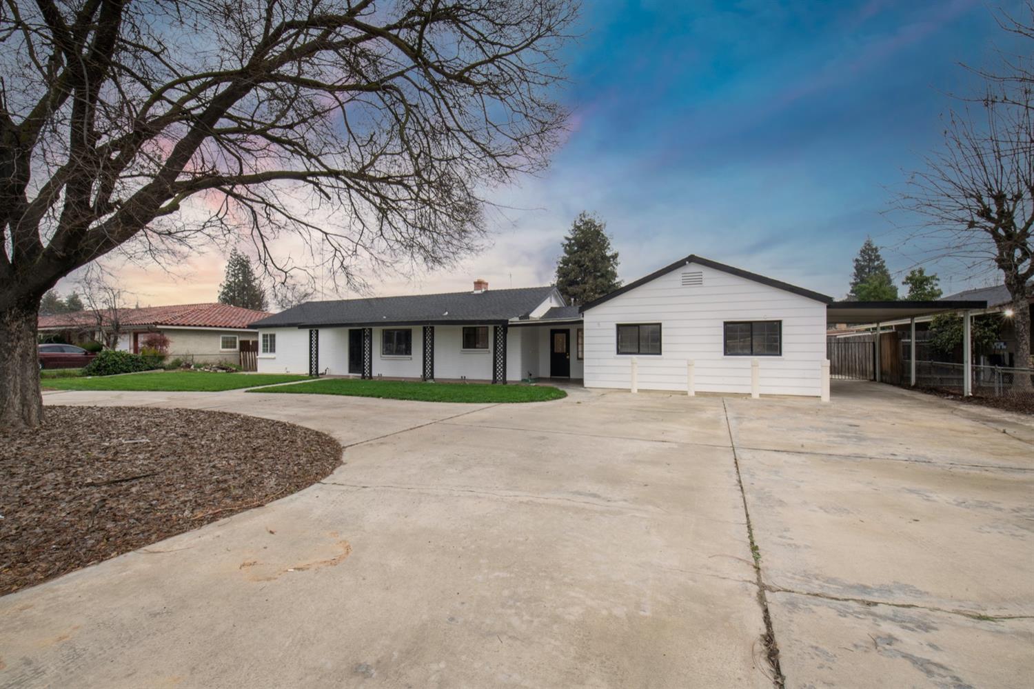 1322 North Reed Avenue Reedley, CA 93654 - Photo 4 of 54 a view of house with a yard