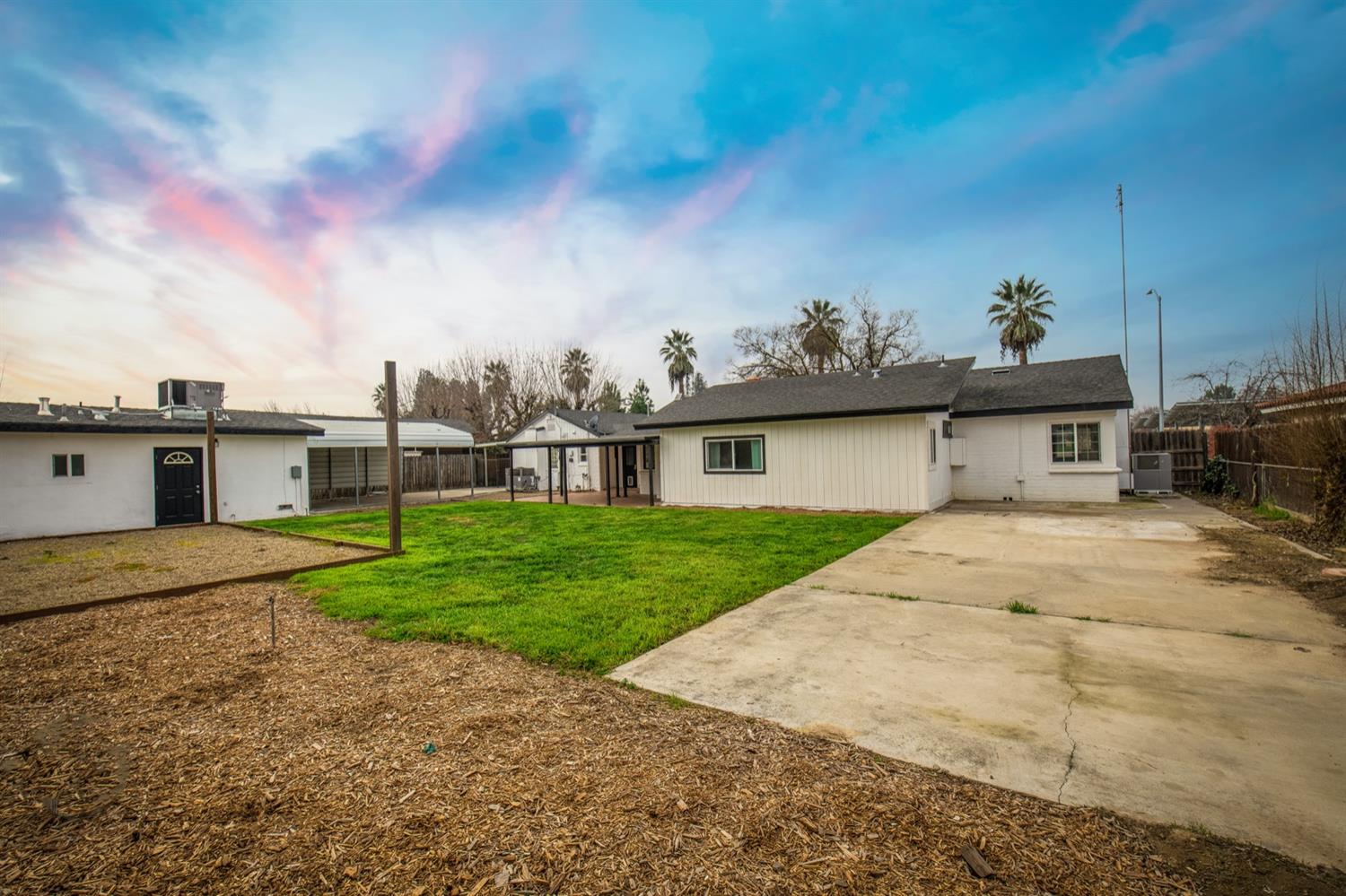 1322 North Reed Avenue Reedley, CA 93654 - Photo 41 of 54 a front view of a house with garden