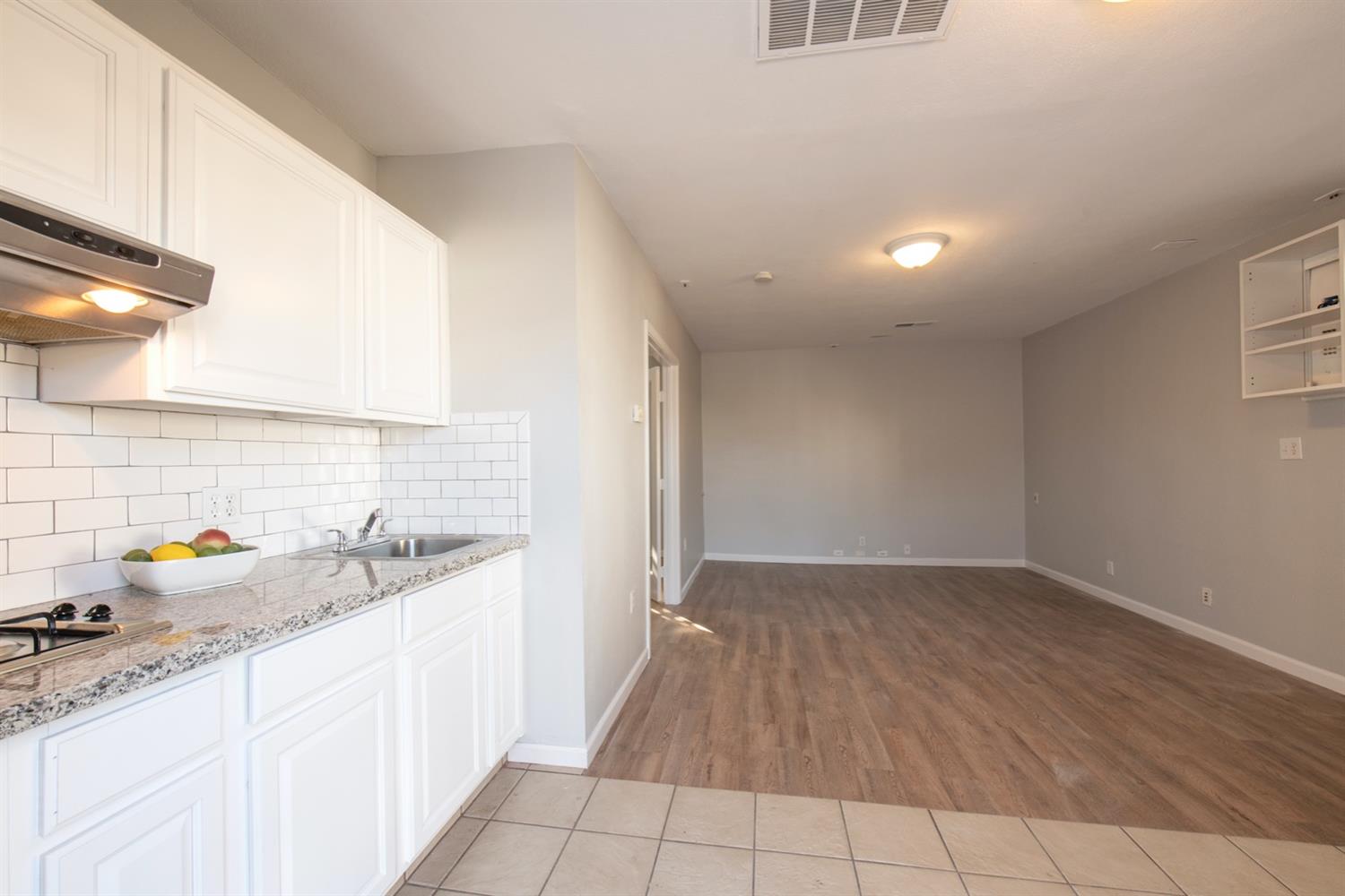 1322 North Reed Avenue Reedley, CA 93654 - Photo 44 of 54 a kitchen with a sink cabinets and a window