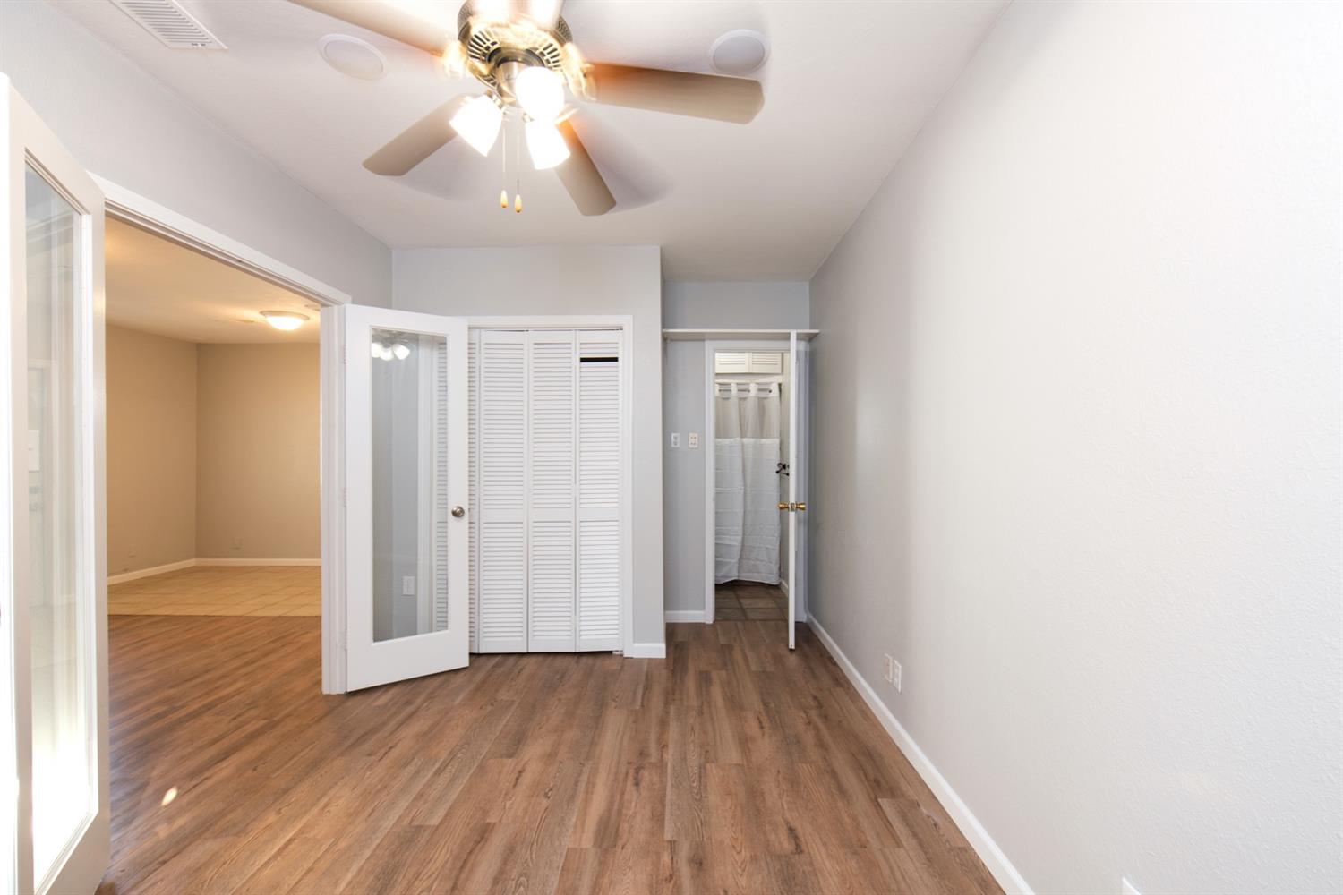 1322 North Reed Avenue Reedley, CA 93654 - Photo 48 of 54 a view of hallway with wooden floor