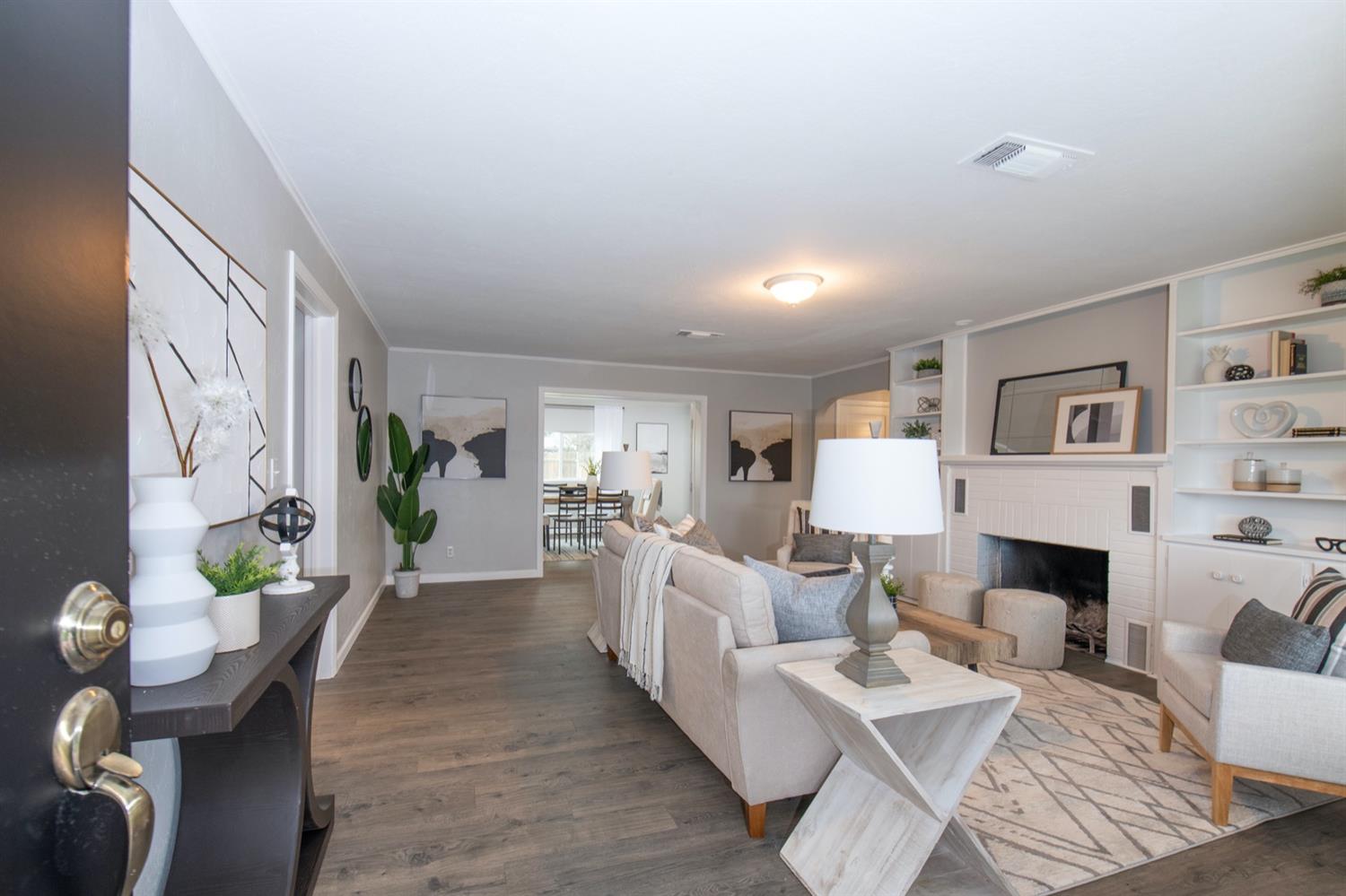 1322 North Reed Avenue Reedley, CA 93654 - Photo 5 of 54 a living room with furniture and a fireplace