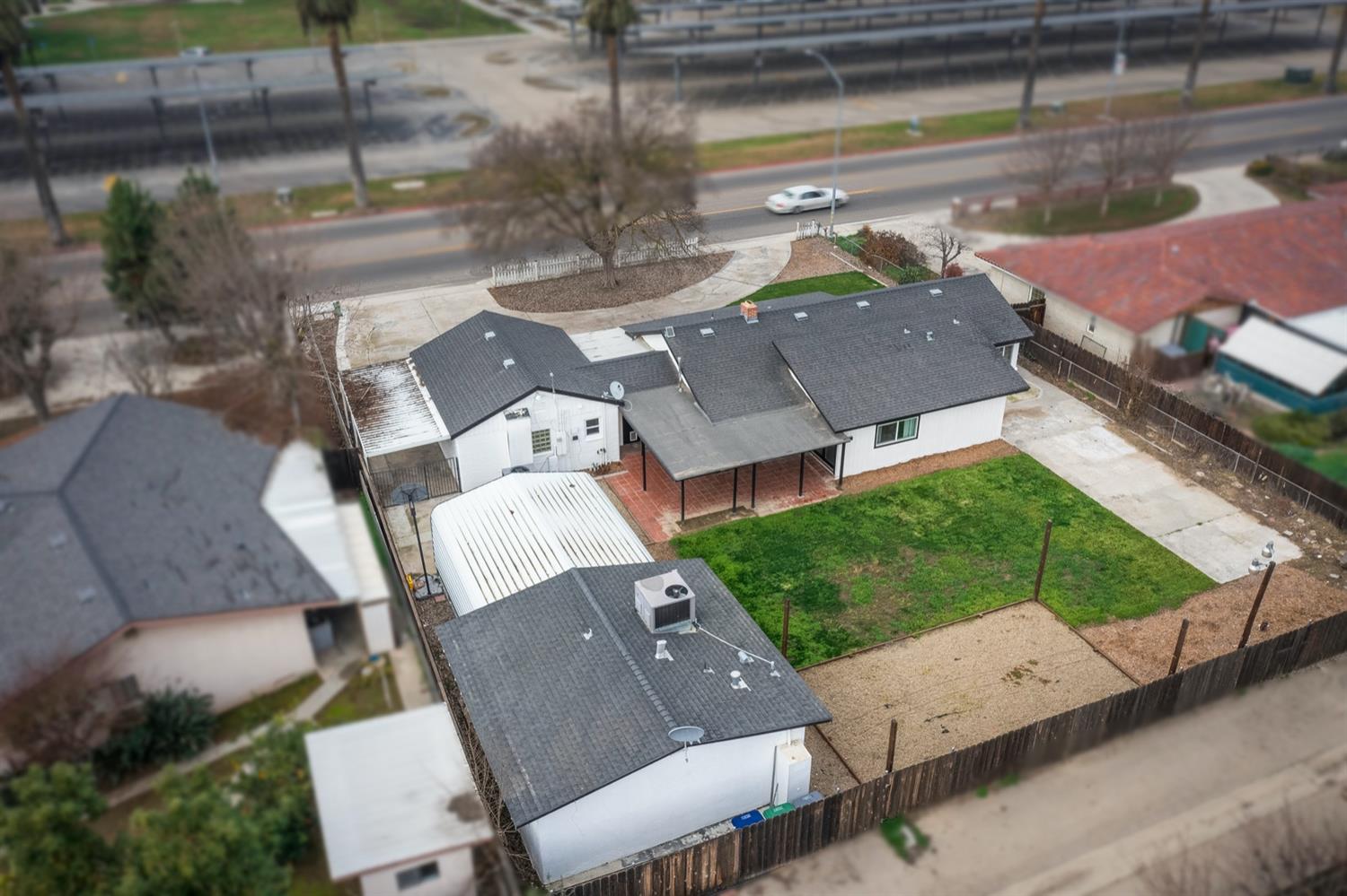 1322 North Reed Avenue Reedley, CA 93654 - Photo 54 of 54 an aerial view of a house with a yard basket ball court and outdoor seating