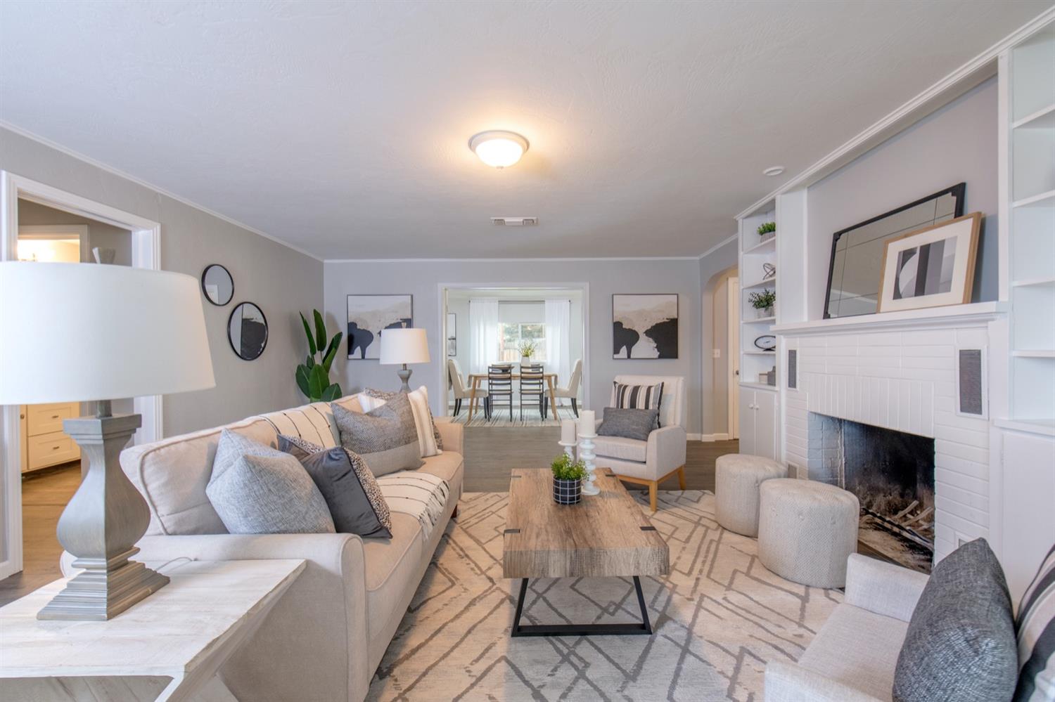 1322 North Reed Avenue Reedley, CA 93654 - Photo 6 of 54 a living room with furniture and a fireplace