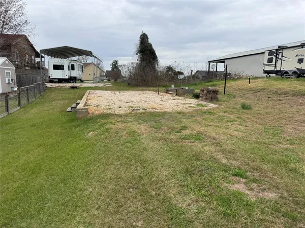 a view of swimming pool with a yard