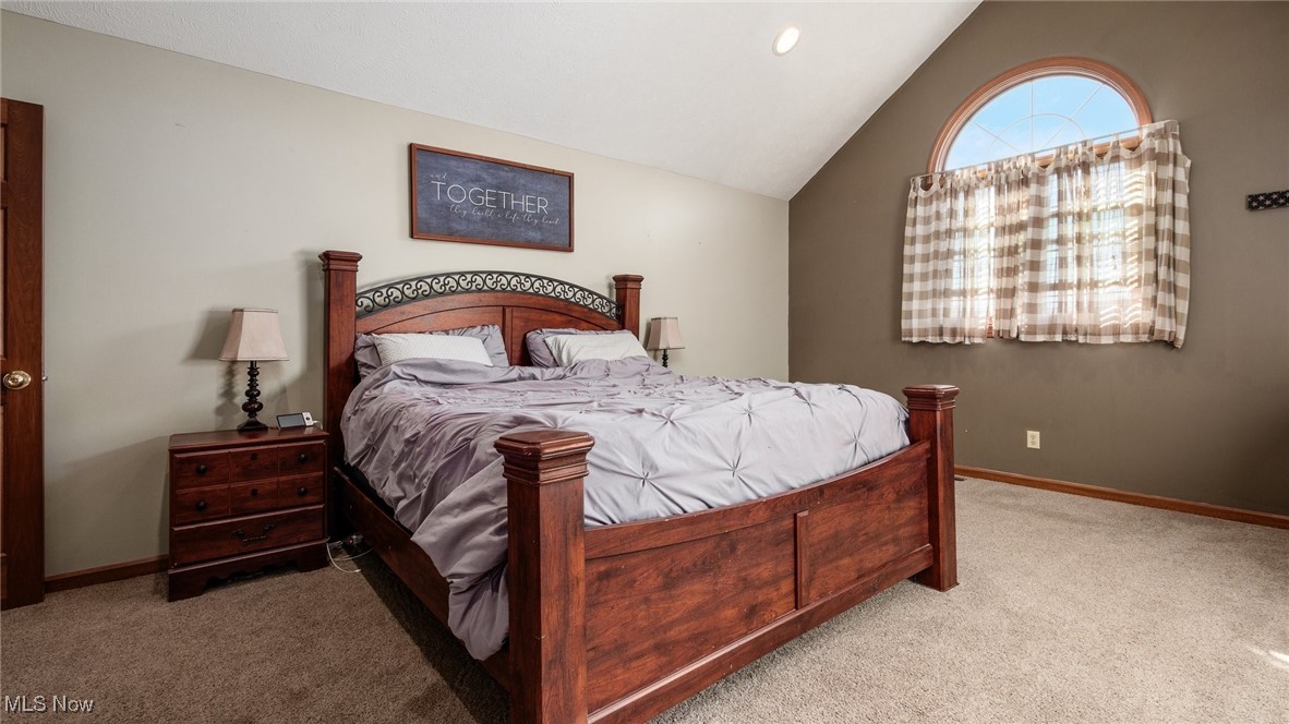 62960 James Road Cambridge, OH 43725 - Photo 20 of 40 Primary Bedroom featuring vaulted ceiling and carpet