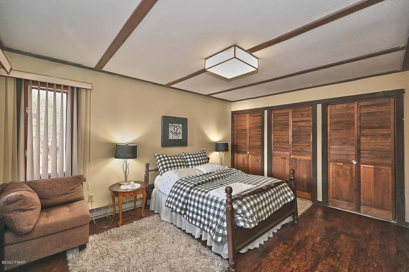 3018 Northgate Road Lake Ariel, PA 18436 - Photo 22 of 51 a bedroom with a bed couch and a large window