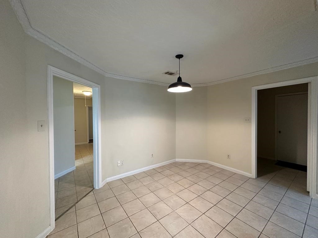 239 Kings Way Stafford, TX 77477 - Photo 5 of 24 a view of an empty room and window