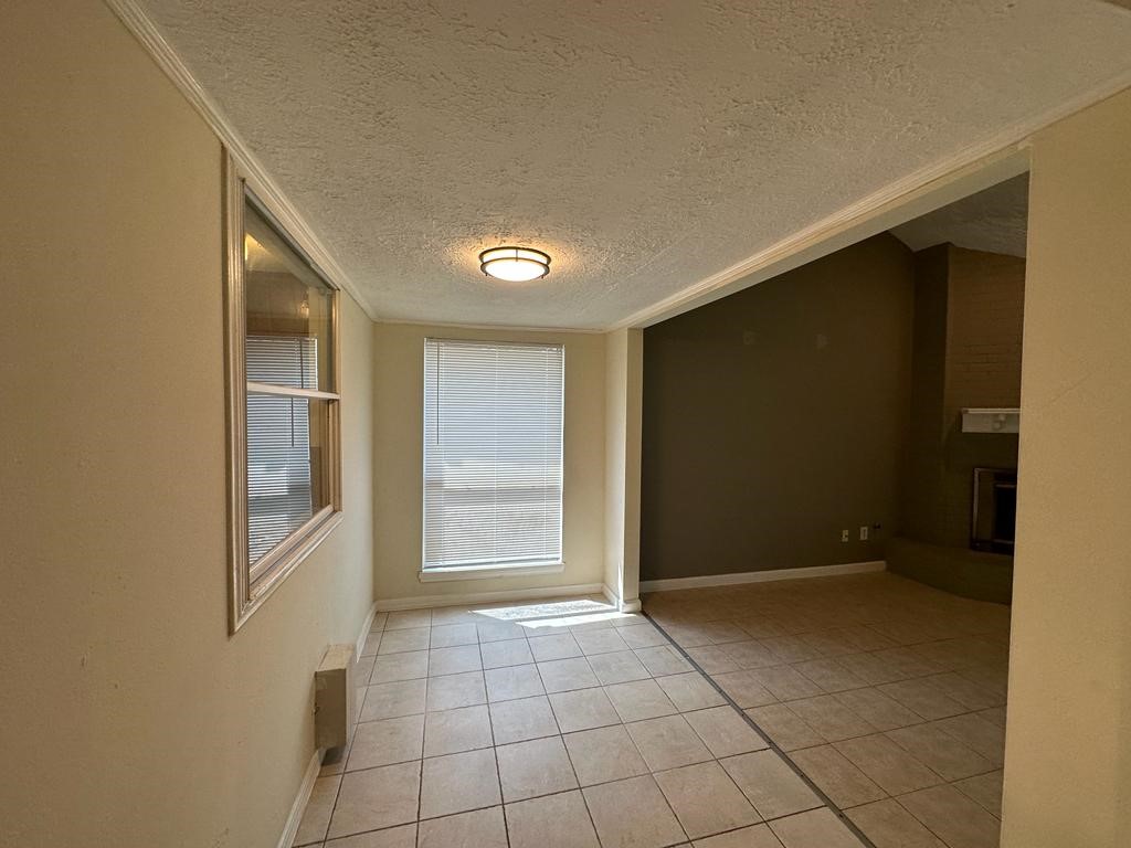 239 Kings Way Stafford, TX 77477 - Photo 6 of 24 a view of an empty room and window