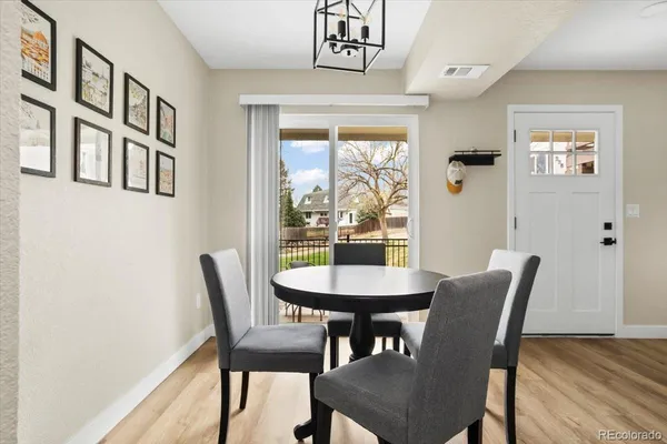 a view of a dining room with furniture window and wooden floor