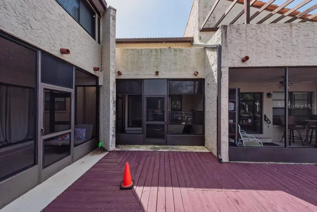 a view of a chairs and table in a patio