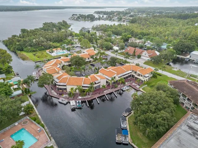 an aerial view of a house with a lake view