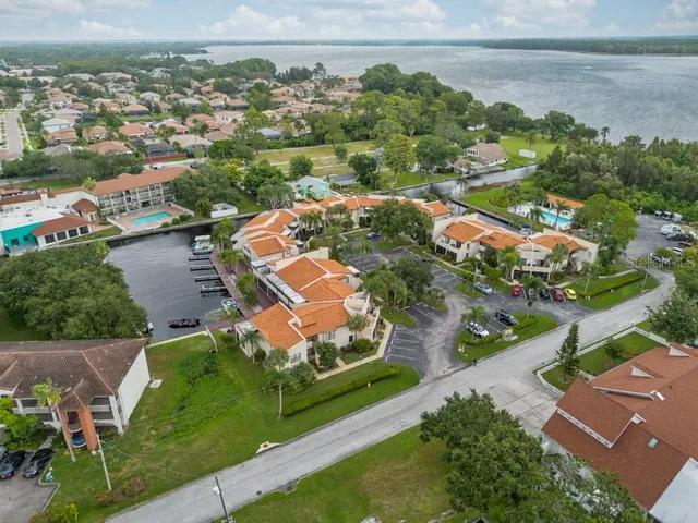 an aerial view of a house with a lake view