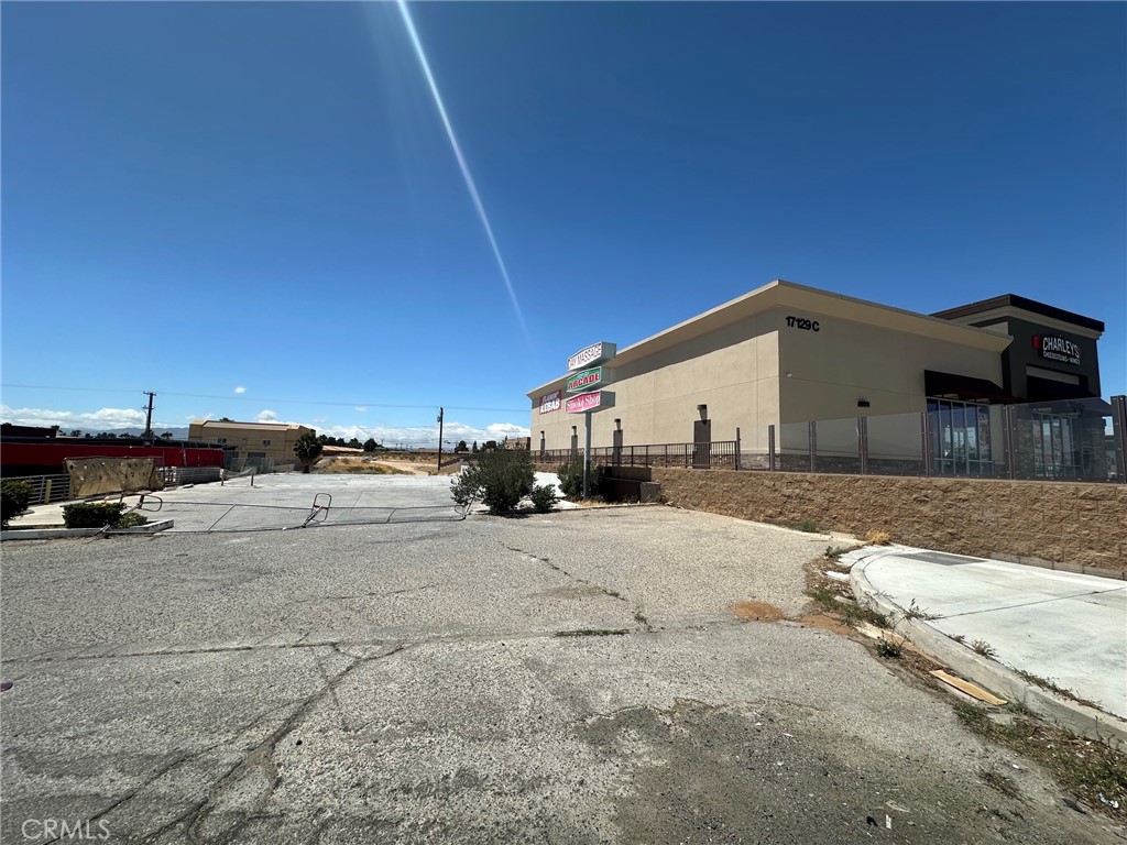 17153 Bear Valley Road Hesperia, CA 92345 - Photo 2 of 9 a view of a house with a yard